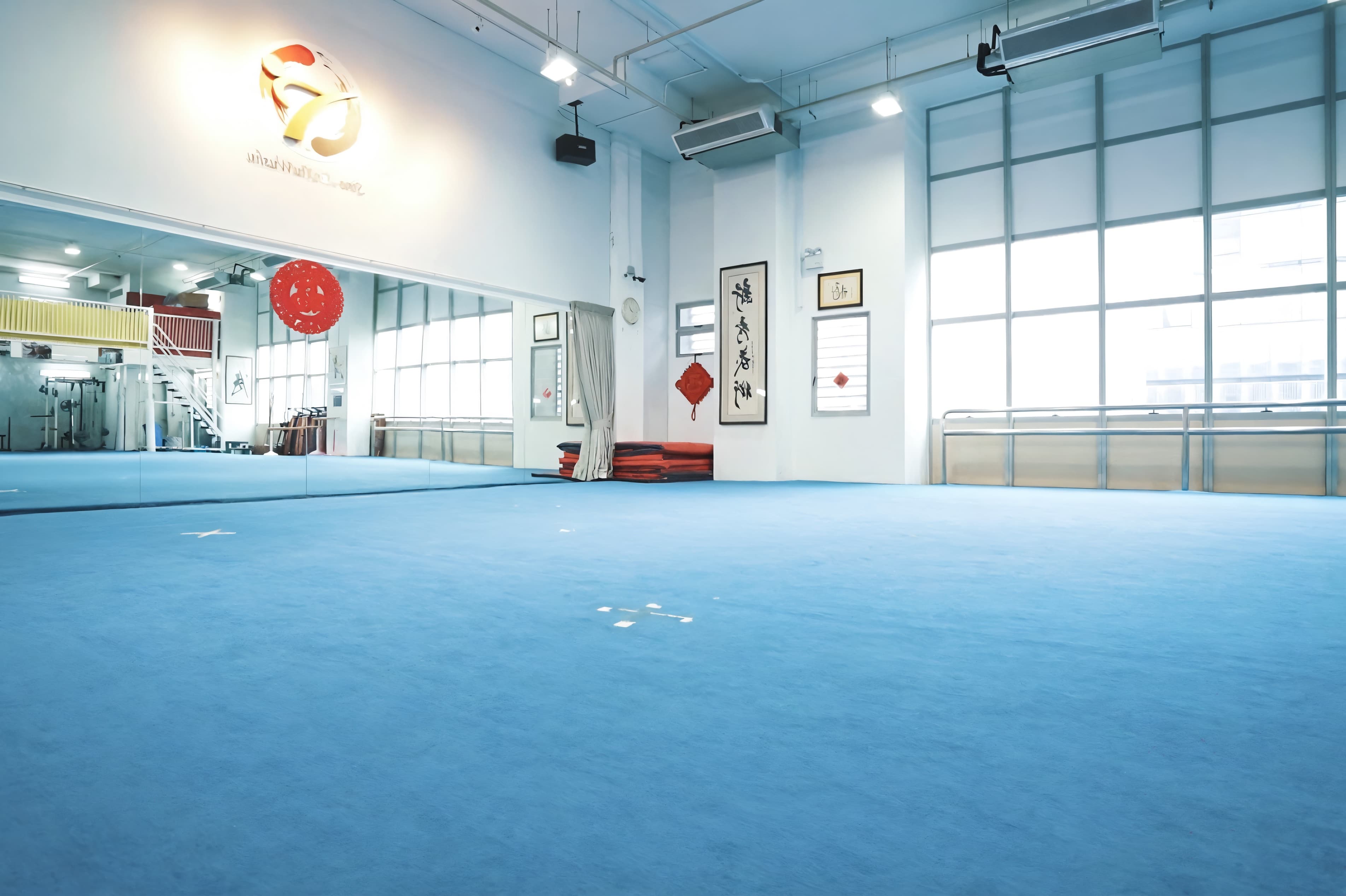 Sino Wushu training hall with traditional calligraphy and full-length mirrors